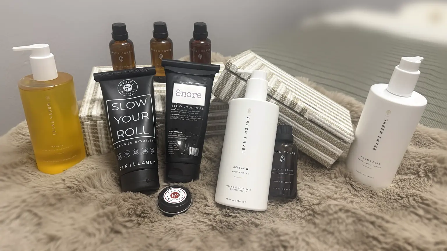 Rebel Massage and Green Envee products arranged in The Well Space treatment room.